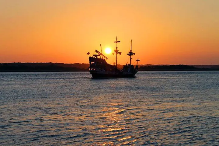 a small boat in a large body of water