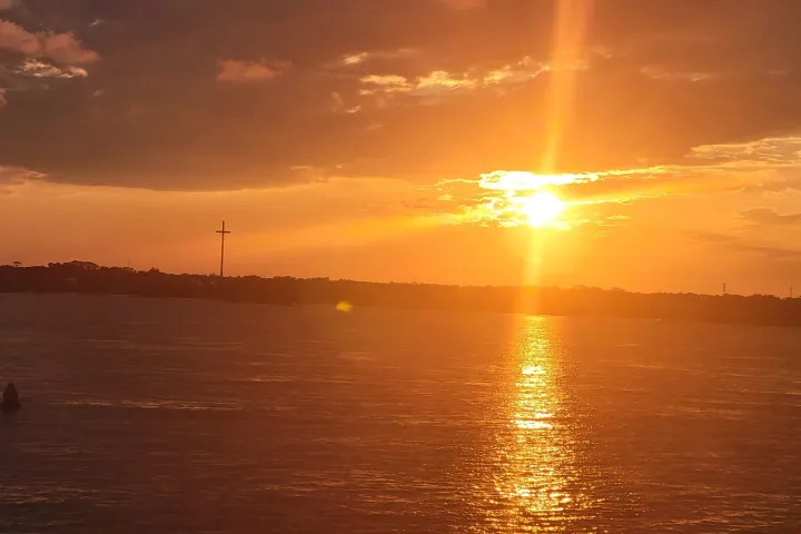 a sunset over a body of water