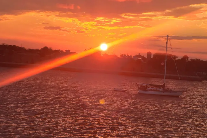 a sunset over a body of water